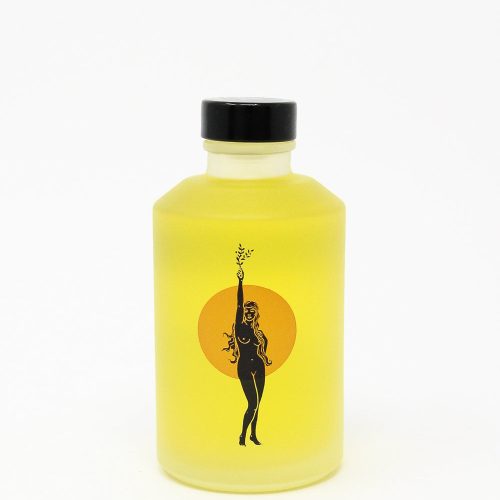 A Wonder Valley yellow bottle with a silhouette of a woman on it, containing Hinoki Body Oil for hydration and skin-softening.