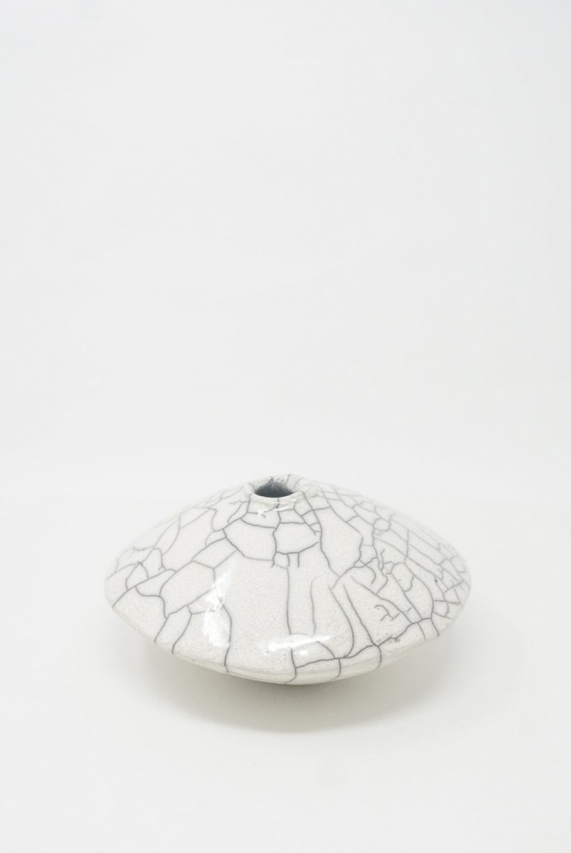 A white, crackle-glazed Ikebana Vase in Raku-Fired Stoneware dish from MONDAYS on a plain background.